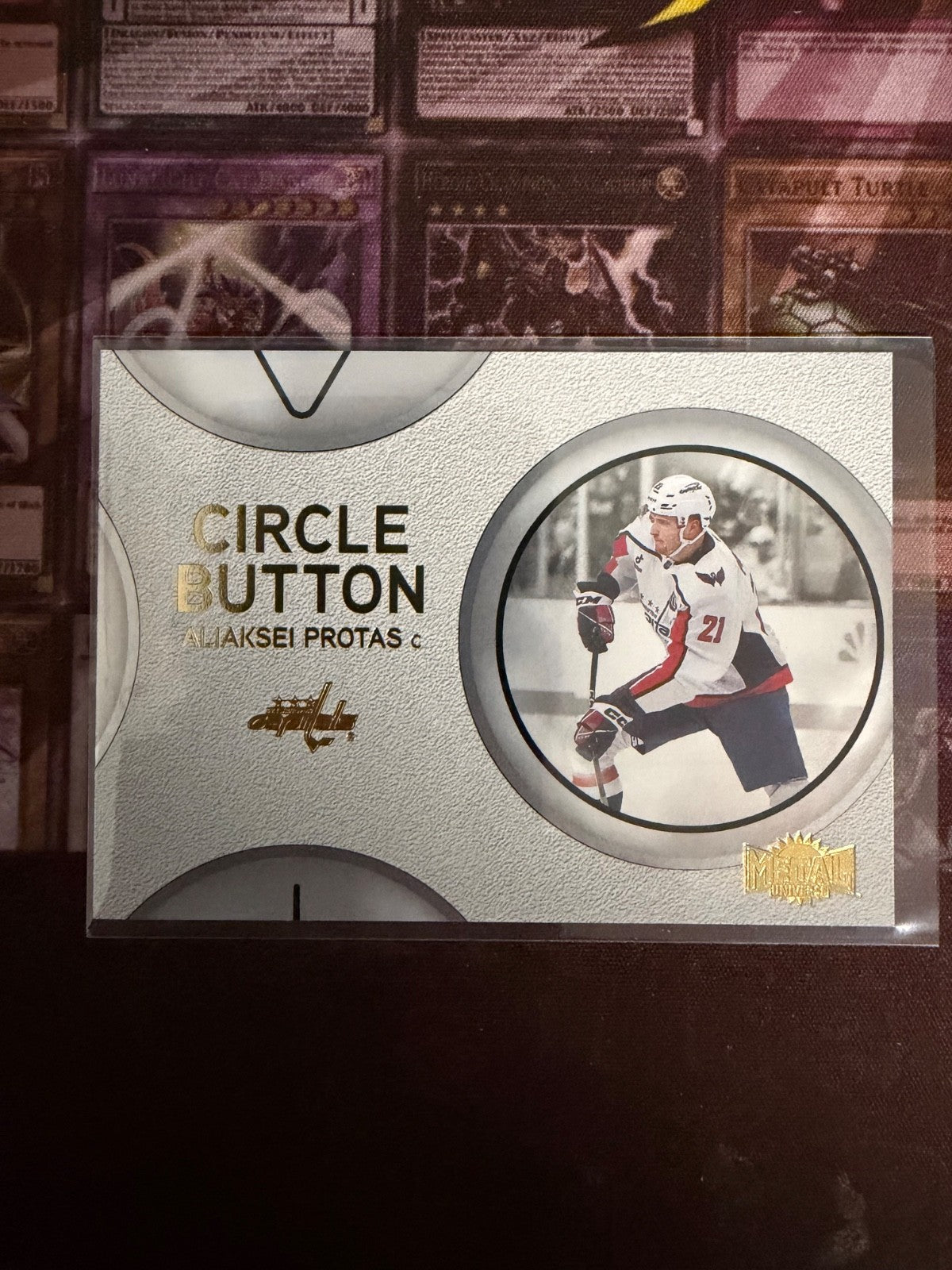 Aliaksei Protas 2024-25 SkyBox Metal Universe Circle Button Insert Washington